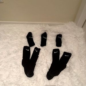 5 pairs of Nike black crew socks. Never worn.
